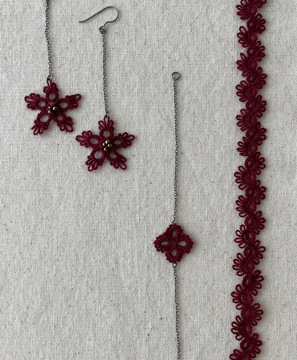 Lace jewelry in dark garnet.