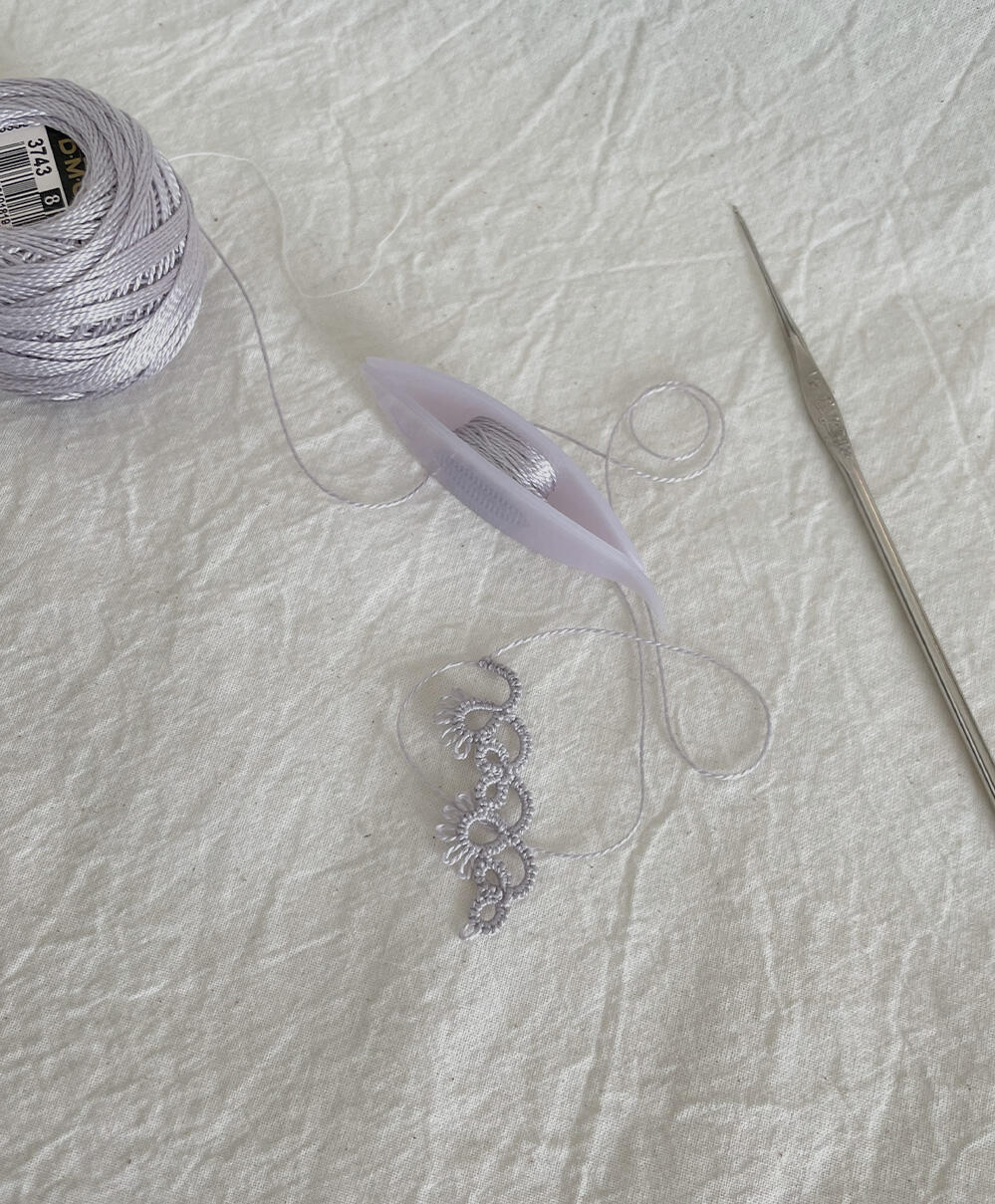 Choker in DMC perle cotton #3743. Clover shuttle.