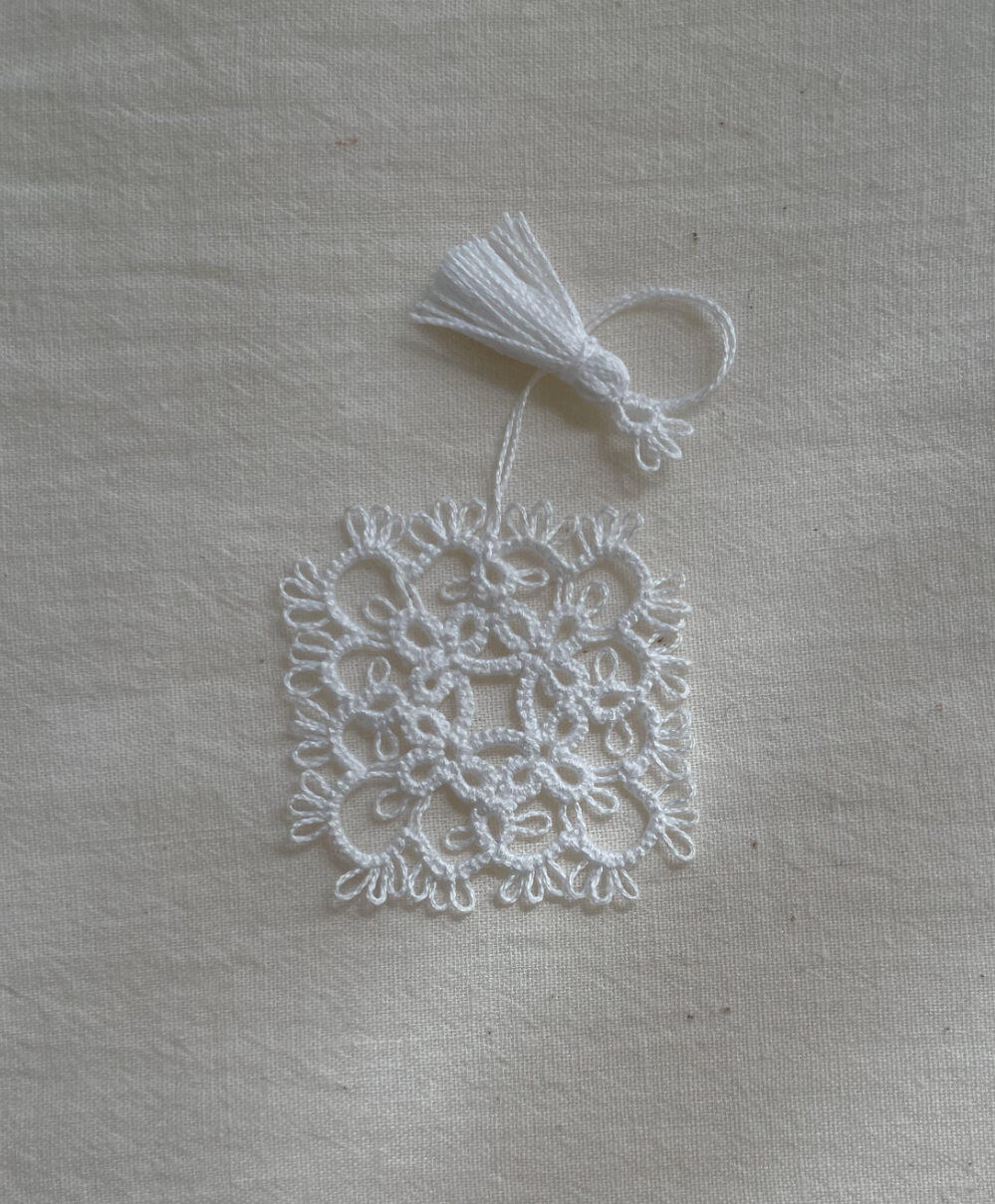 Mini square doily bookmark in white. 2026.