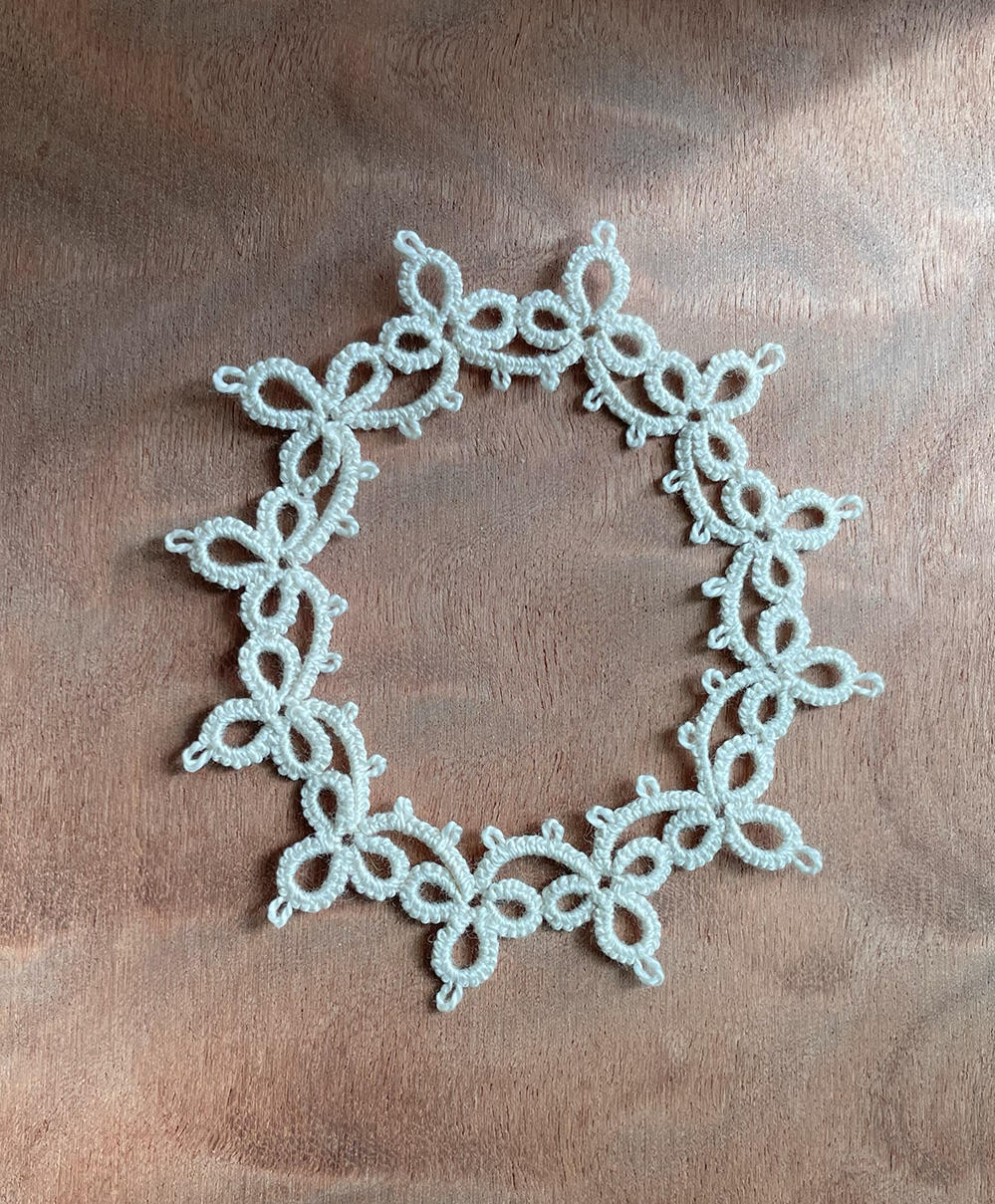 Ecru oval frame.