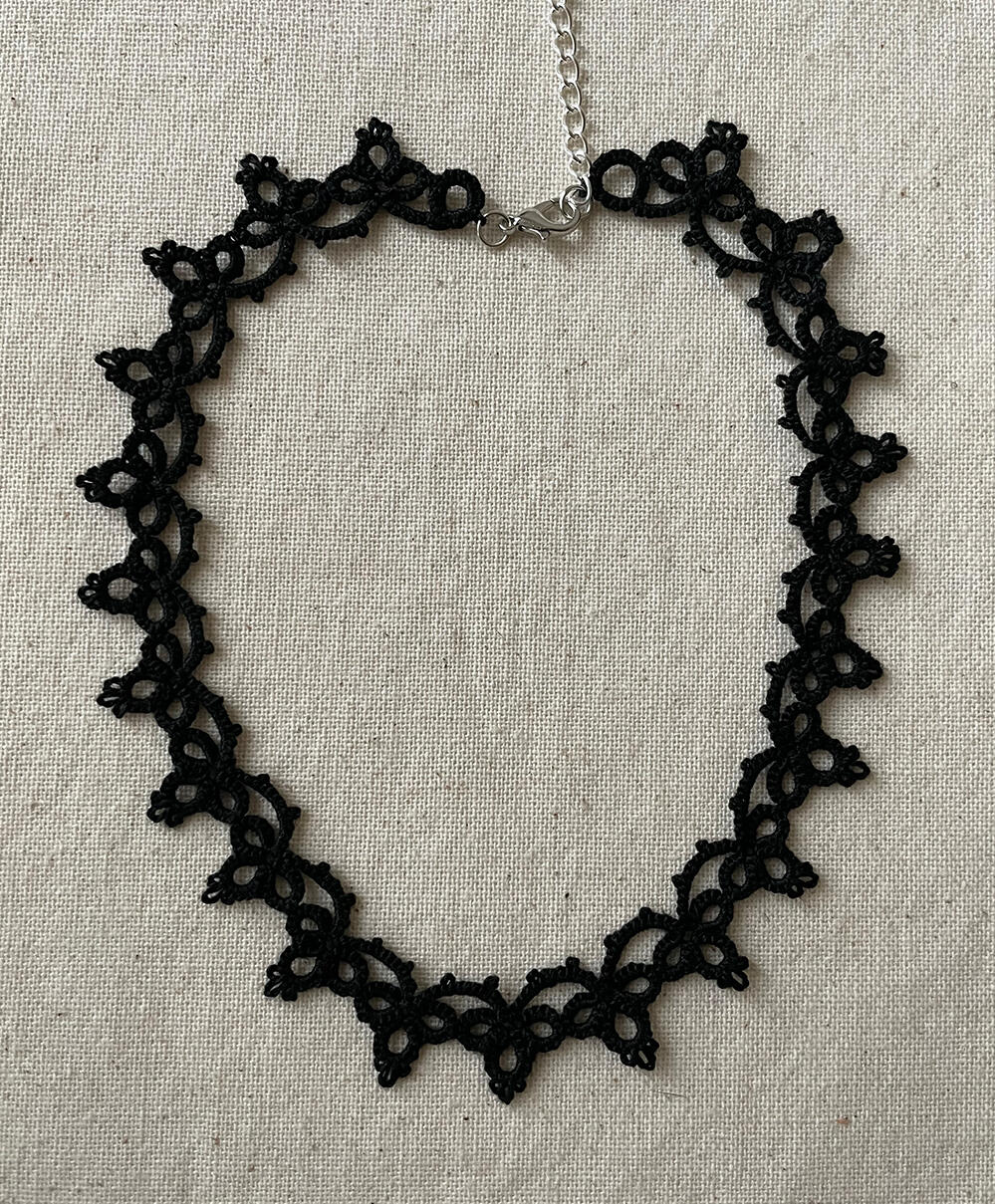 Shuttle tatting lace necklace in black. 2025.